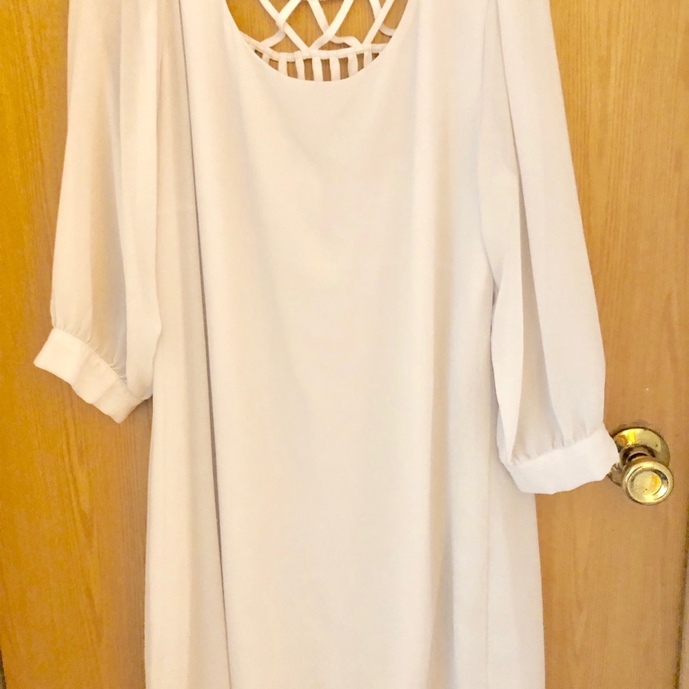 White dress with detailed back. XL in juniors.